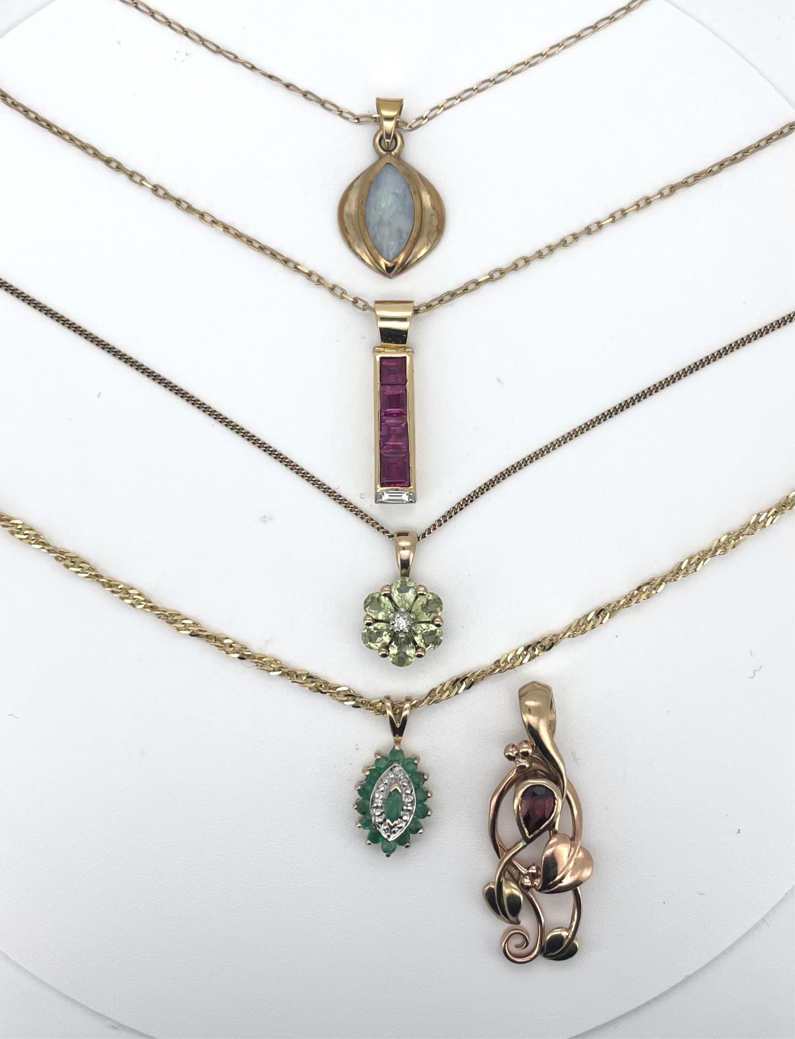 Three assorted 9ct and gem set pendants on 9ct chains, including emerald and diamond navette shaped cluster and single stone white opal doublet?, together with an unmarked yellow metal and gem set line pendant on a 9ct c